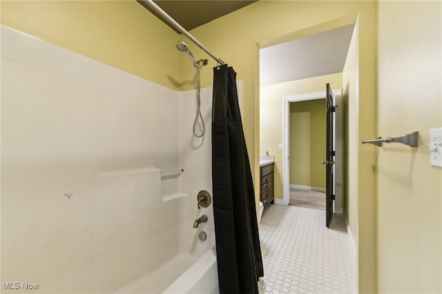 bathroom featuring vanity and shower / bath combo