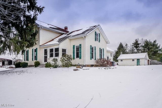 view of snow covered house