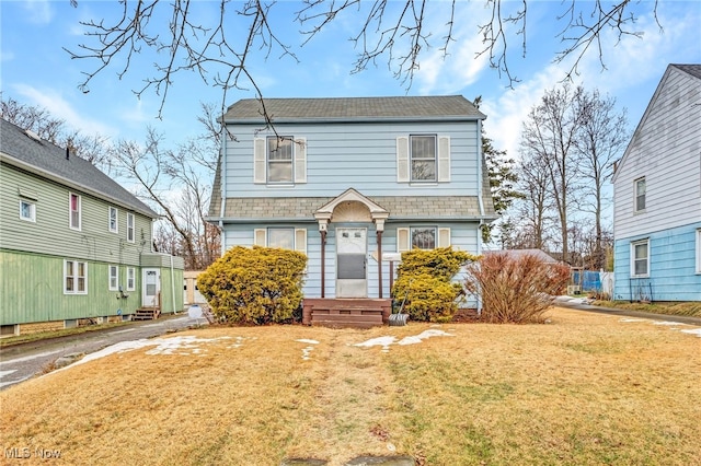 view of front of home with a front yard