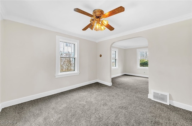 carpeted empty room featuring crown molding and ceiling fan