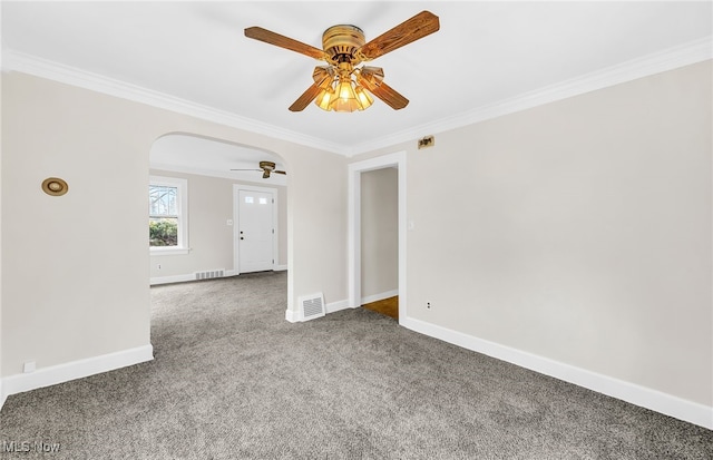 carpeted spare room featuring ornamental molding and ceiling fan