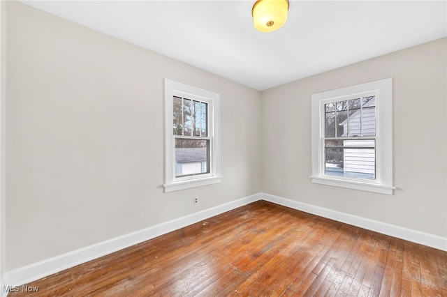 spare room featuring hardwood / wood-style floors