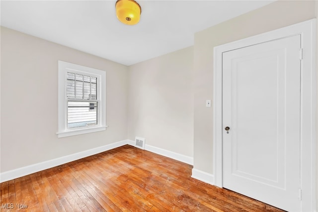 spare room featuring light hardwood / wood-style floors