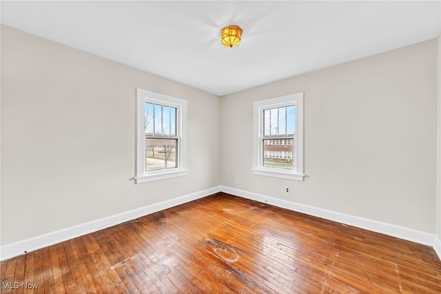 spare room featuring hardwood / wood-style flooring