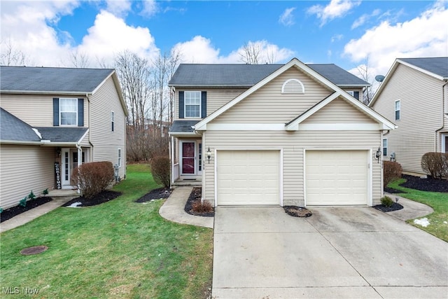 view of front property featuring a garage and a front yard