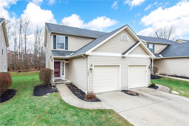 view of front property with a garage and a front yard