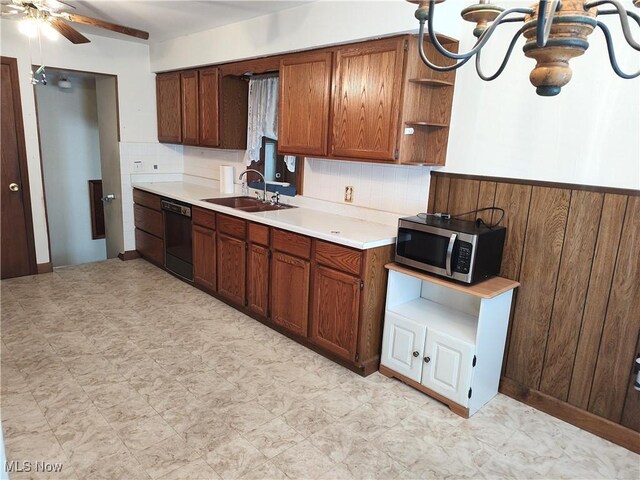 kitchen featuring ceiling fan, dishwasher, and sink