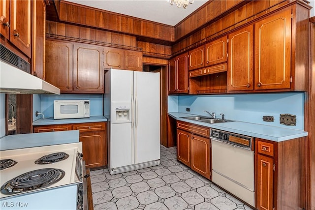 kitchen with sink and white appliances