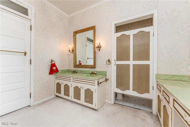 bathroom with ornamental molding and vanity