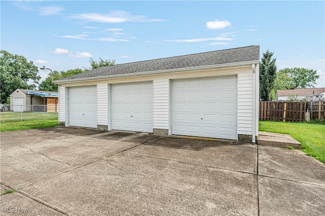 garage with a yard