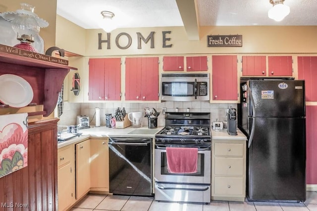 kitchen featuring backsplash, beam ceiling, light tile patterned flooring, and black appliances