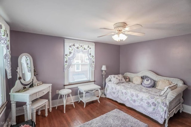 bedroom featuring dark wood-type flooring and ceiling fan