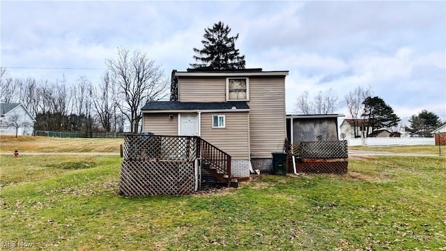 back of house with a yard