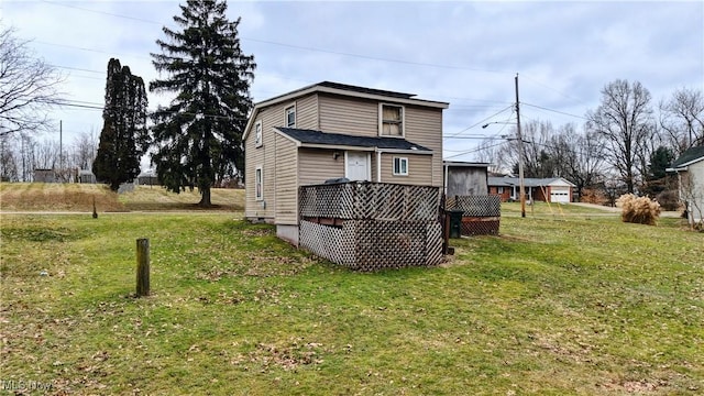 rear view of house with a lawn