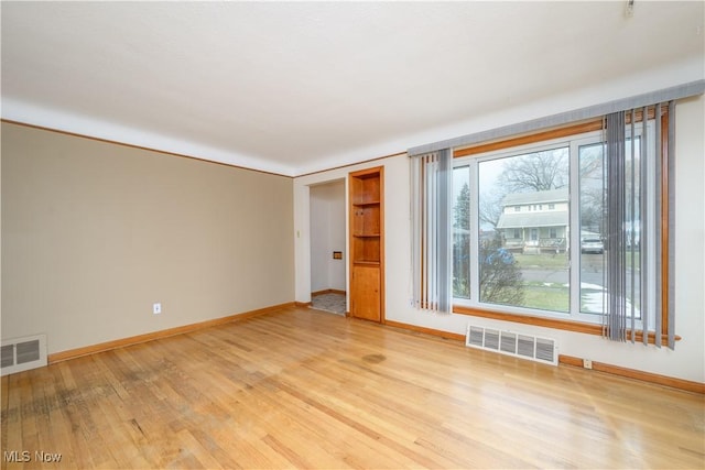 empty room with light wood-type flooring