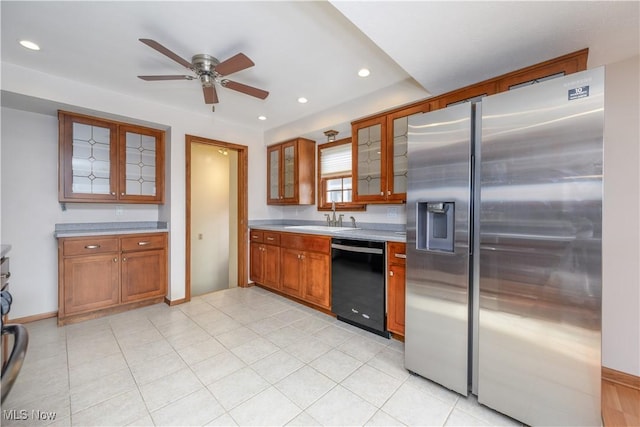 kitchen with light tile patterned flooring, dishwasher, sink, stainless steel fridge, and ceiling fan