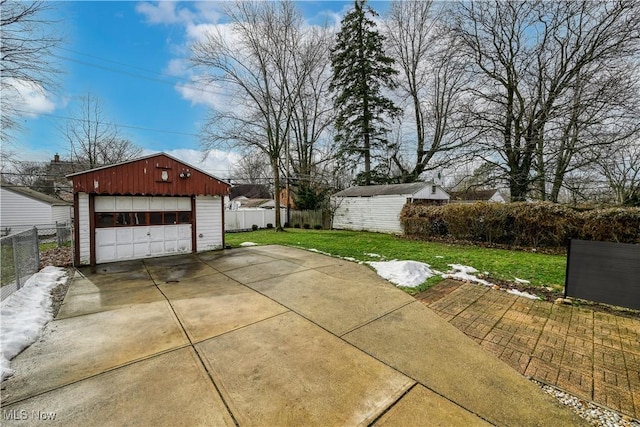 exterior space with a storage shed and a garage