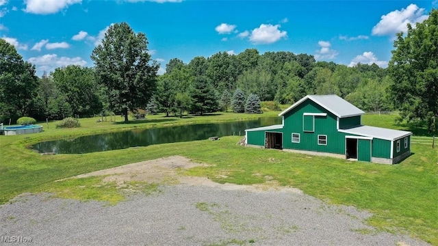 exterior space with a yard and a water view