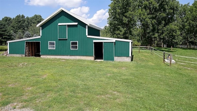 view of outbuilding with a lawn