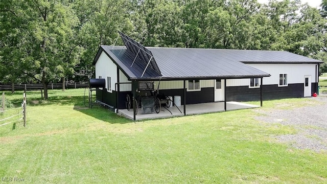 rear view of house with a lawn