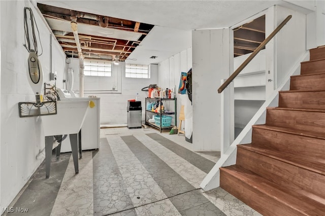 basement with washer / clothes dryer and sink