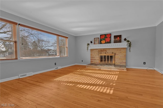 unfurnished living room featuring light wood-type flooring