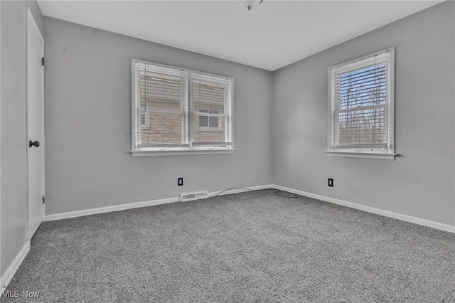 unfurnished room featuring carpet