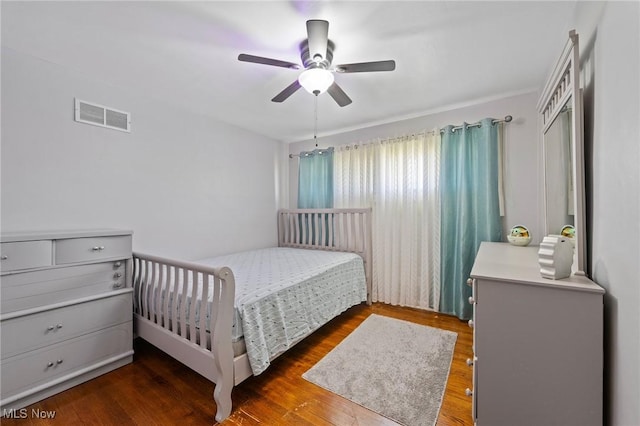 bedroom featuring dark wood-type flooring and ceiling fan