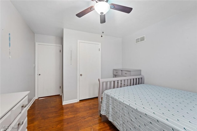 bedroom featuring ceiling fan and dark hardwood / wood-style flooring