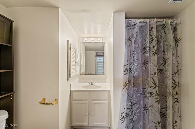 bathroom featuring vanity and a shower with curtain