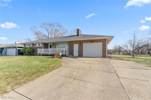 single story home with a garage, a front lawn, and a porch