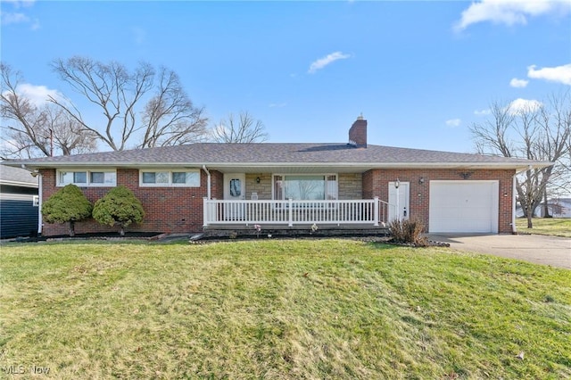 ranch-style house with a garage, covered porch, and a front yard