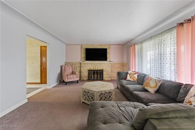 living room featuring carpet floors and a fireplace