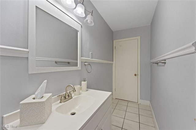 bathroom featuring tile patterned flooring and vanity