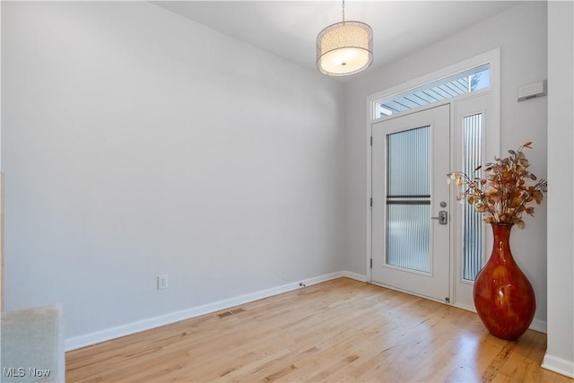 foyer with light hardwood / wood-style flooring