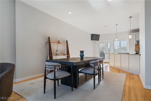 dining space featuring light hardwood / wood-style floors