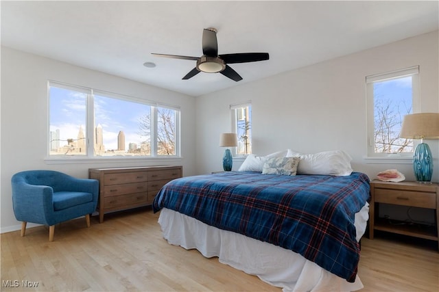 bedroom featuring light hardwood / wood-style flooring and ceiling fan