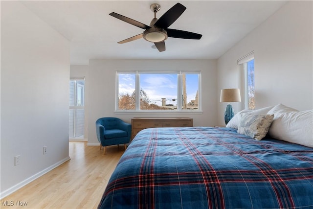 bedroom featuring light hardwood / wood-style flooring and ceiling fan