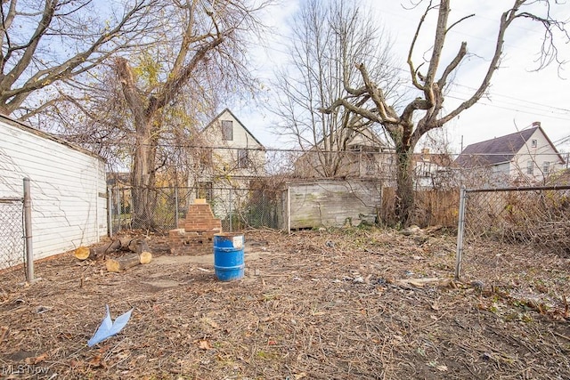 view of yard with a fireplace