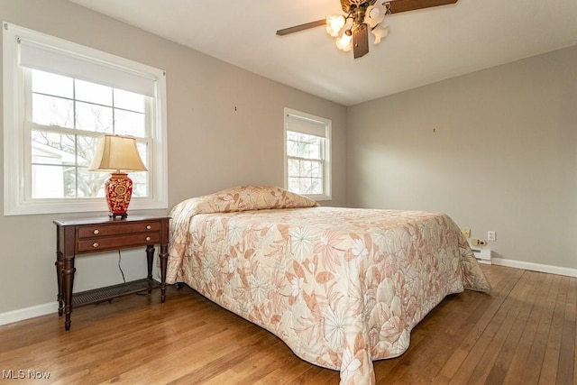 bedroom featuring ceiling fan and light hardwood / wood-style flooring