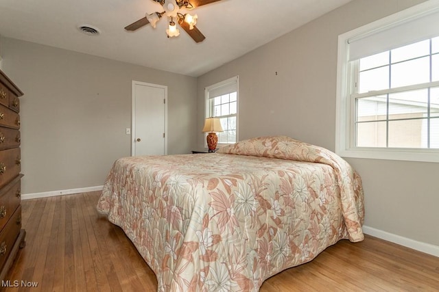 bedroom featuring hardwood / wood-style flooring and ceiling fan