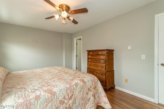 bedroom with hardwood / wood-style flooring and ceiling fan