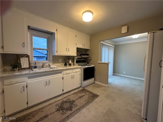 kitchen with white cabinetry, sink, light stone counters, and white appliances