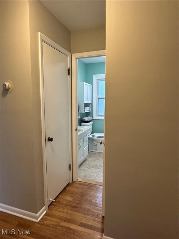 hallway with light wood-type flooring