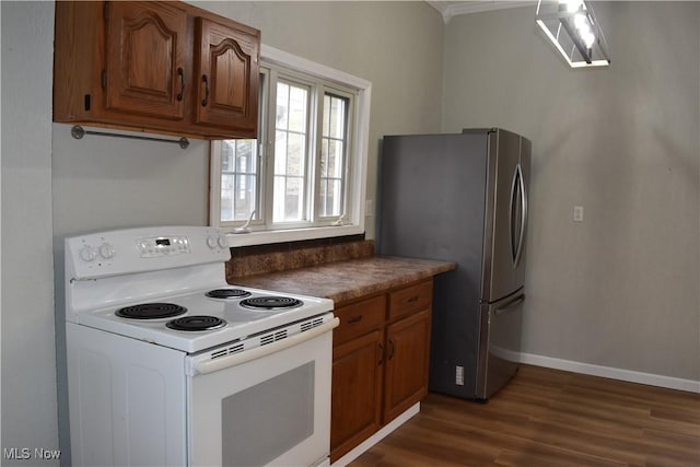 kitchen featuring electric range, stainless steel fridge, and dark hardwood / wood-style floors