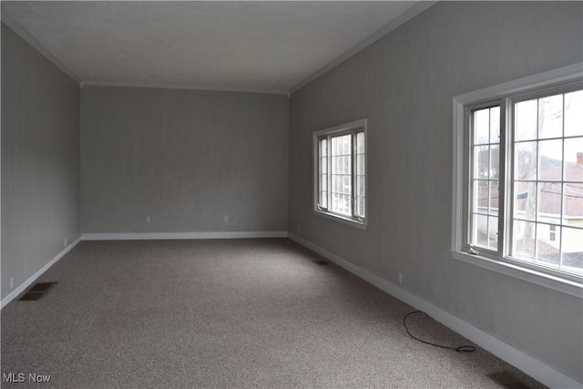 carpeted empty room with ornamental molding