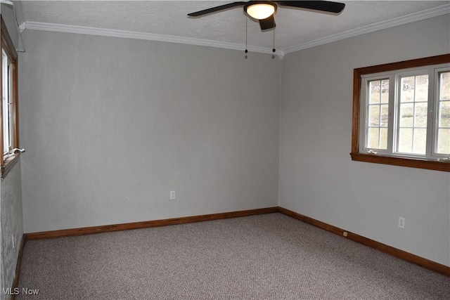 carpeted empty room with a textured ceiling, ornamental molding, and ceiling fan