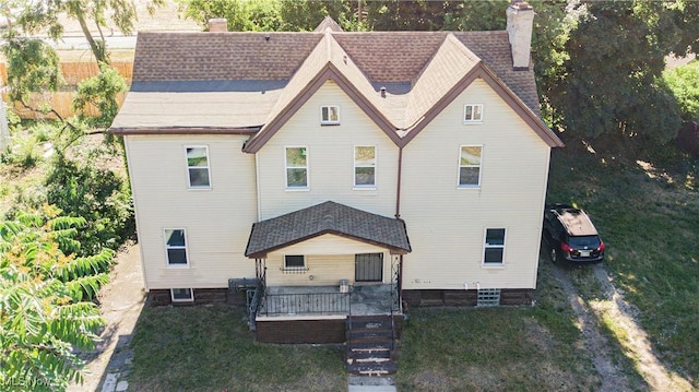 view of front of home featuring a deck and a front lawn