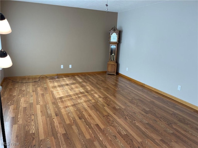 unfurnished living room with hardwood / wood-style flooring