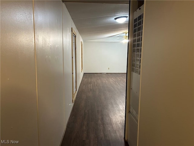 hallway with dark wood-type flooring